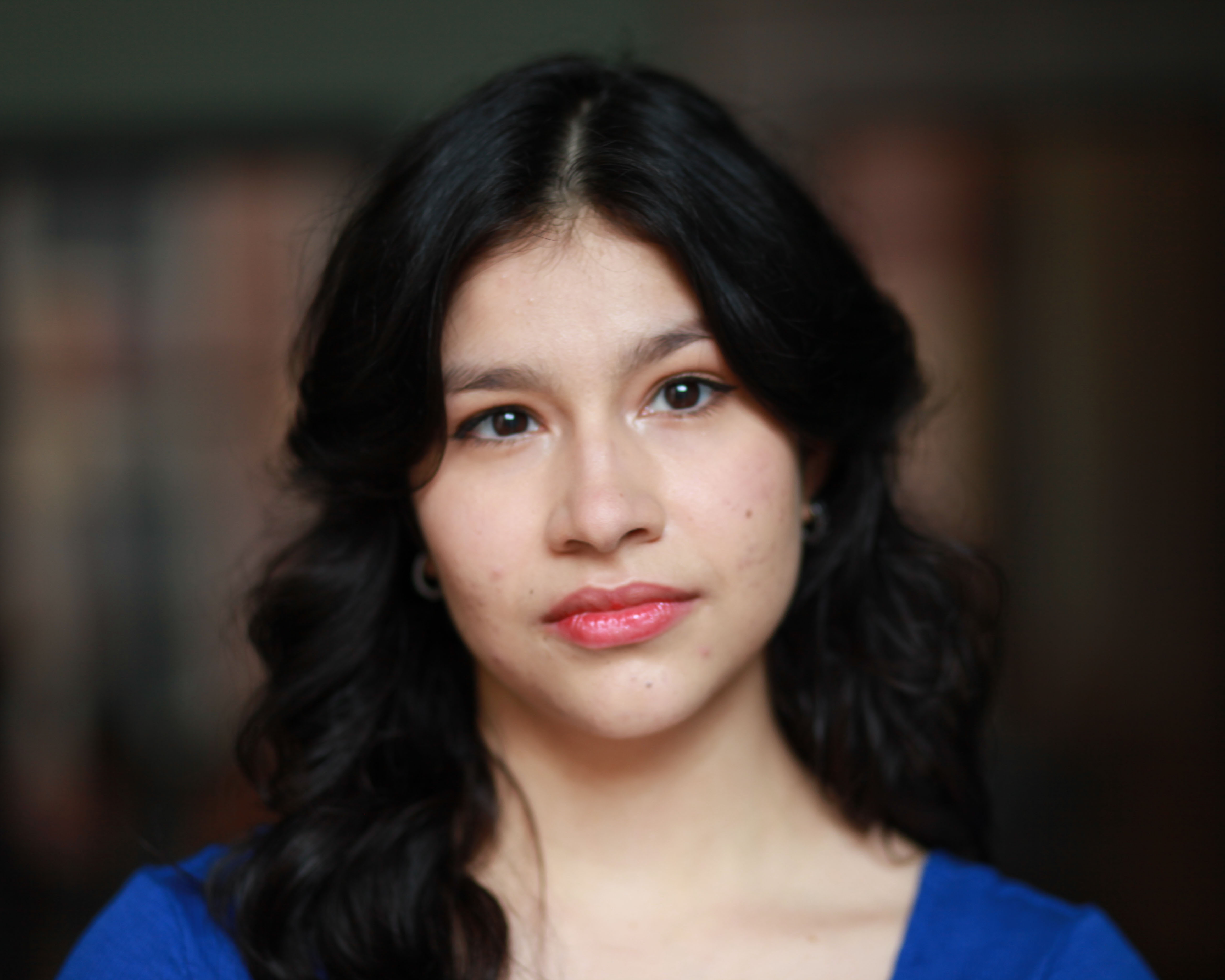 Professional headshot of Anneth Paola Davis with a neutral expression