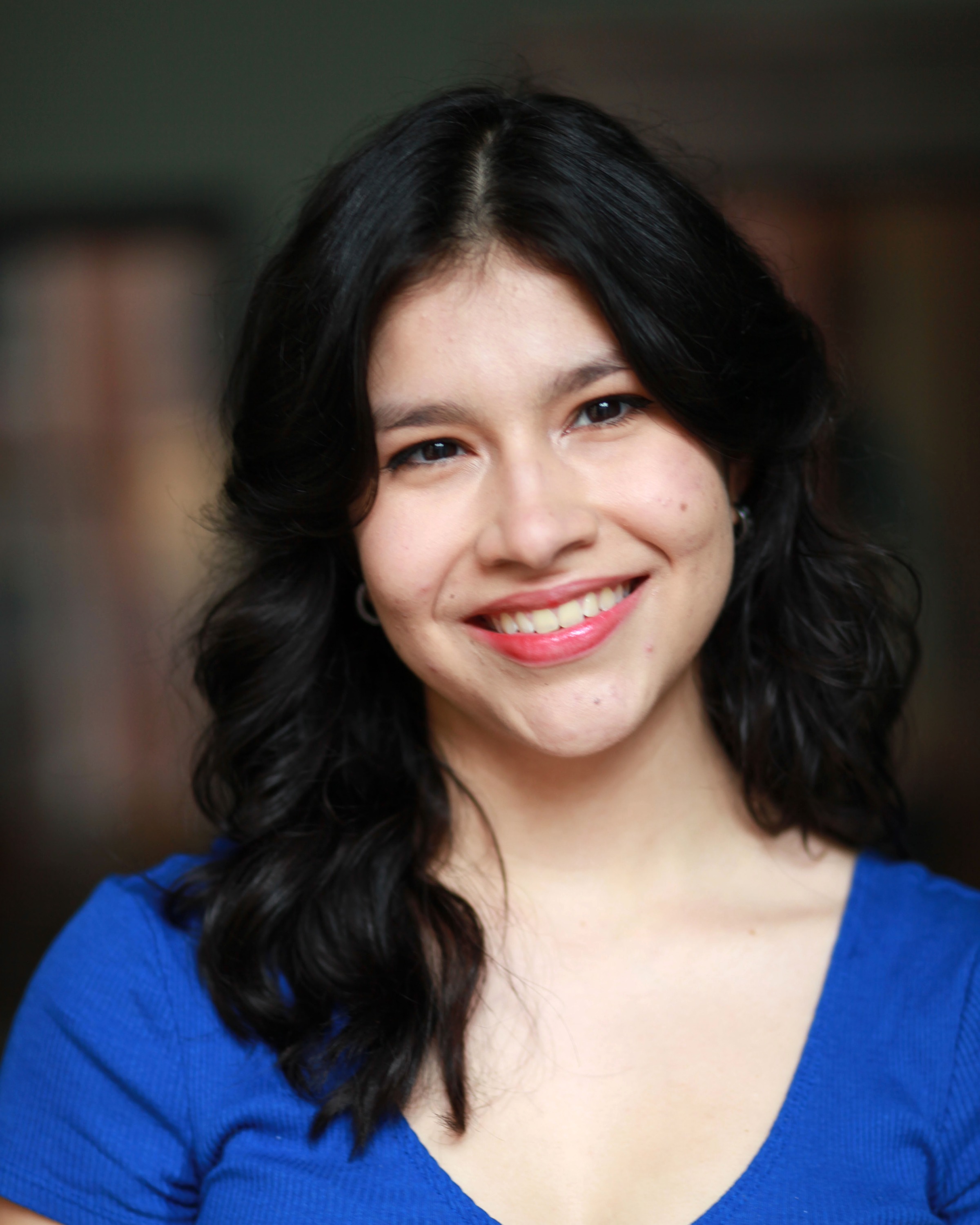 Headshot of Anneth Paola Davis, smiling