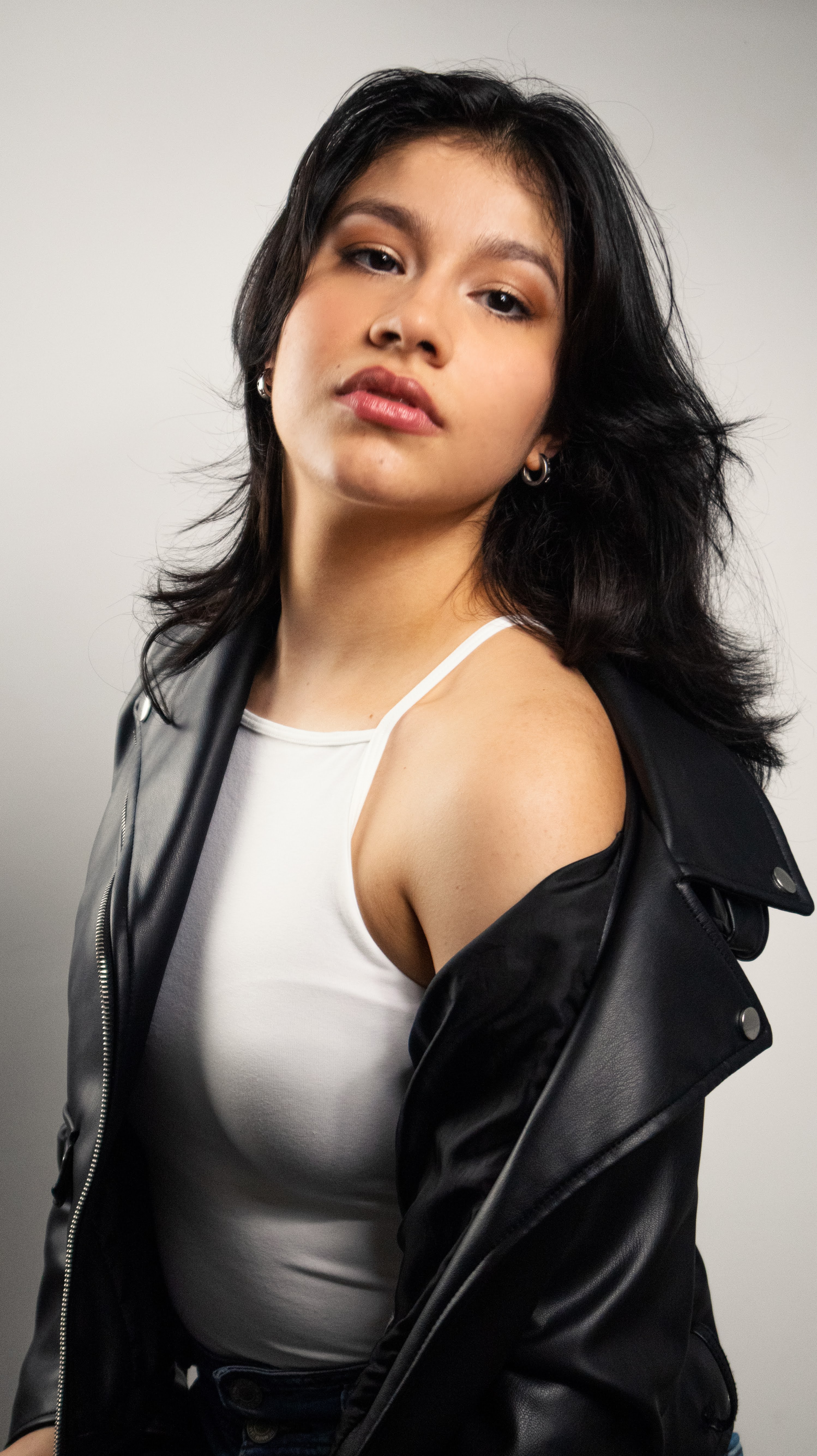 Editorial portrait of Anneth Paola Davis in a leather jacket