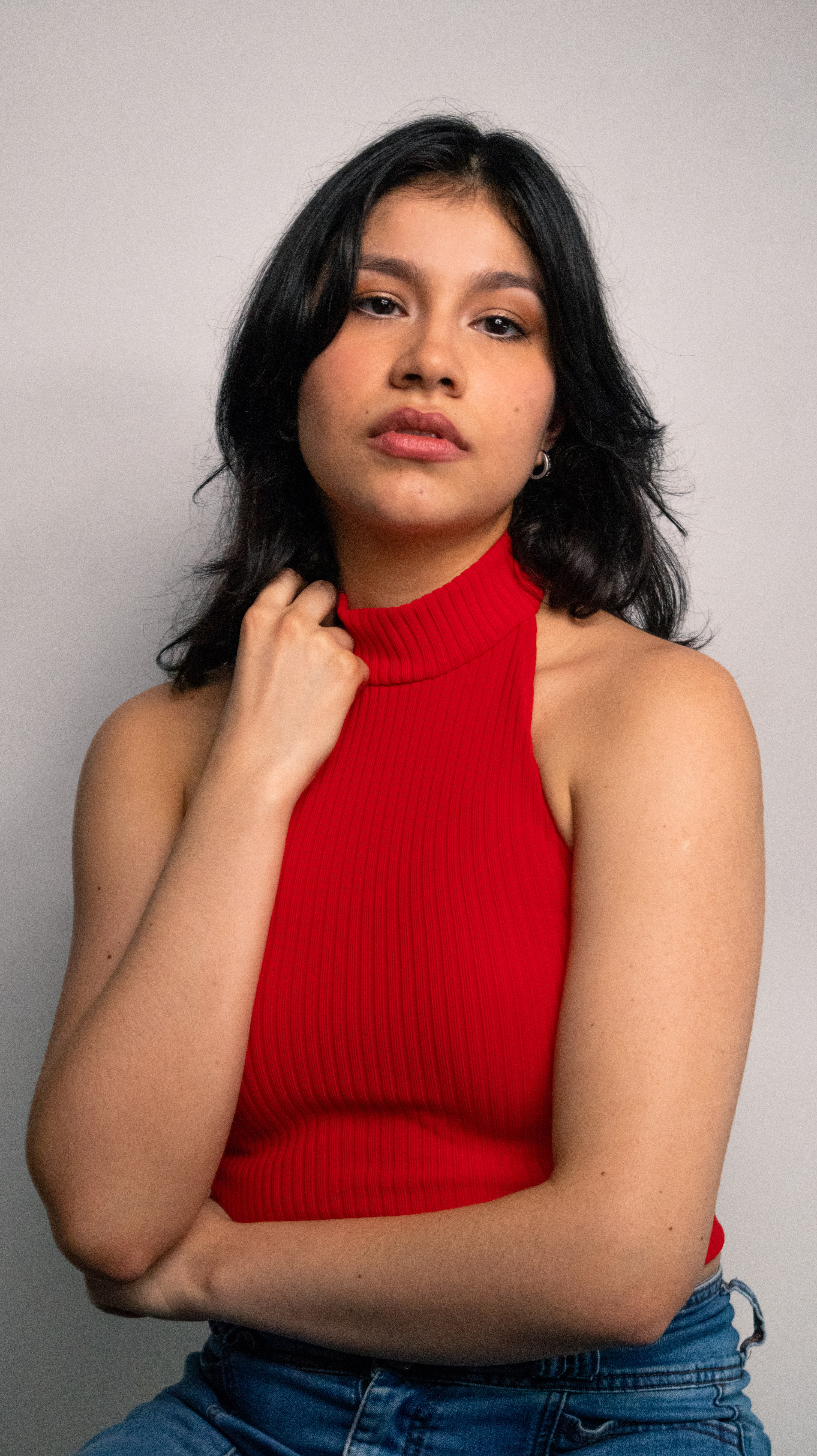 Anneth Paola Davis, editorial portrait in a red top